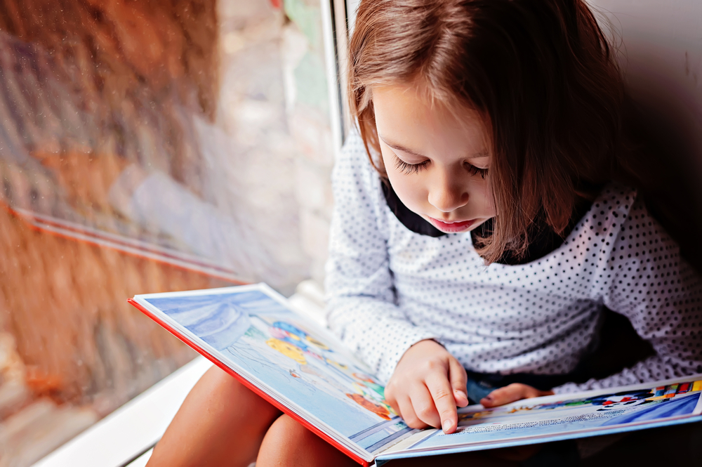 girl is reading a book