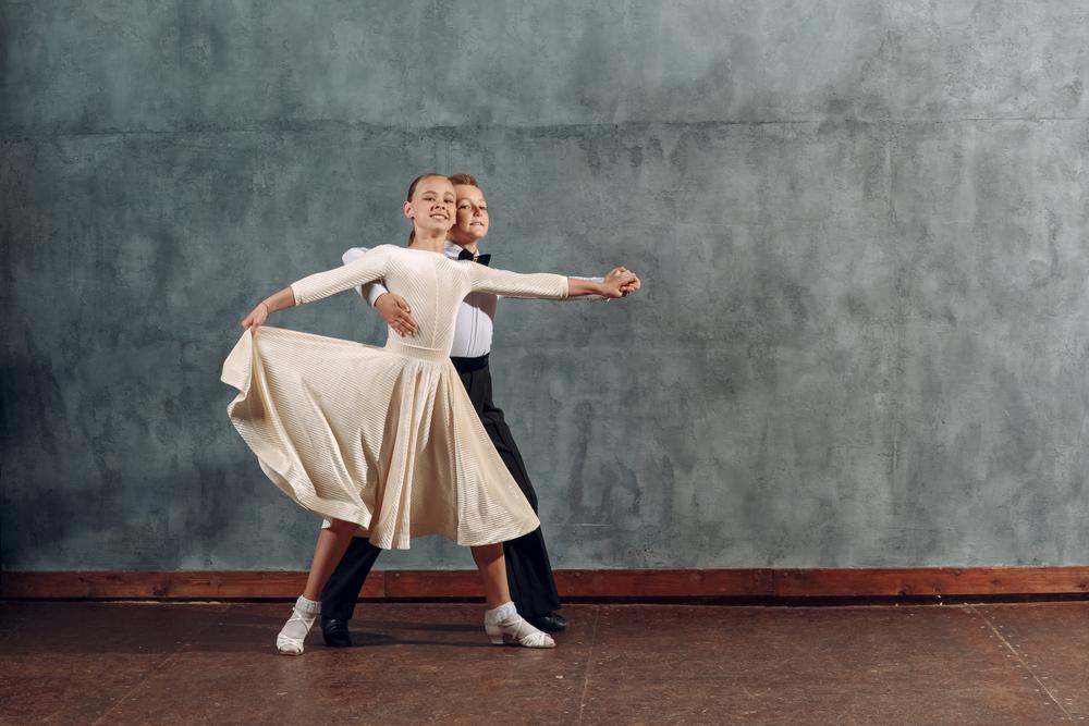 a boy and girl dancing