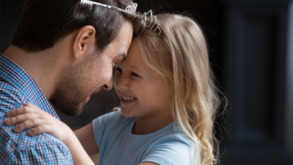 father and daughter looking at each other