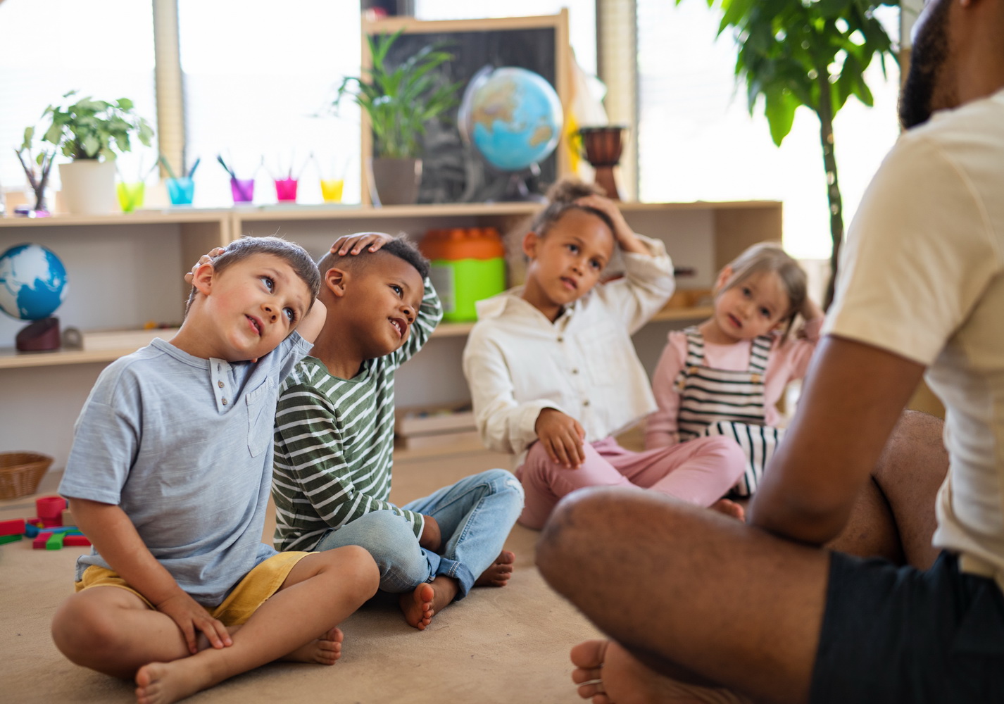 nursery school children with man teacher sitting o 2026 03 10 03 58 59 utc