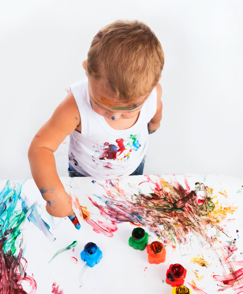 a boy is painting