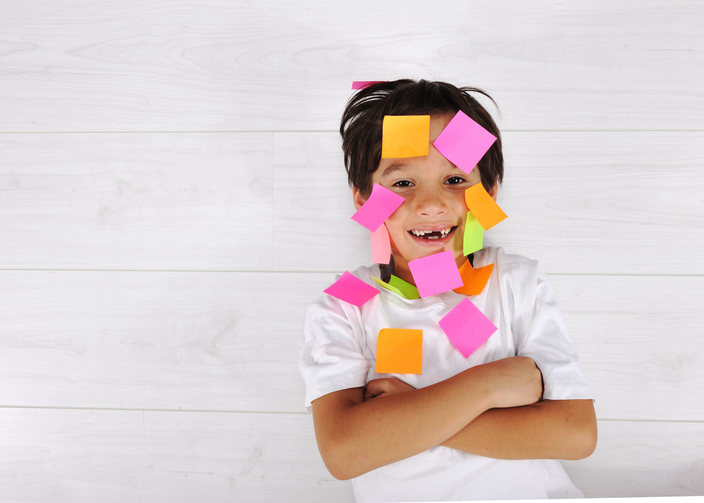 a boy with stickers on his face