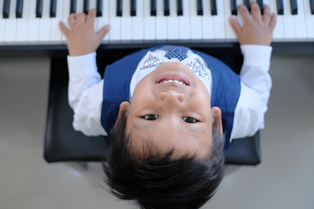 boy playing piano