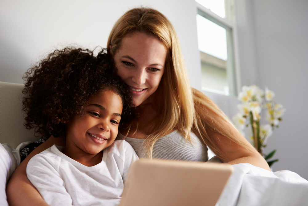 mom and daughter using a tablet