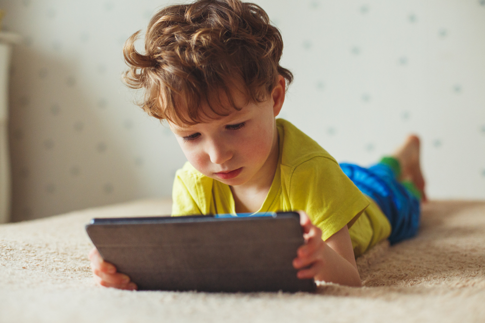 kid with tablet