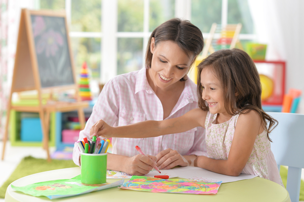 mom and her daughter painting