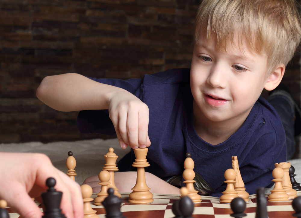 boy playing chess