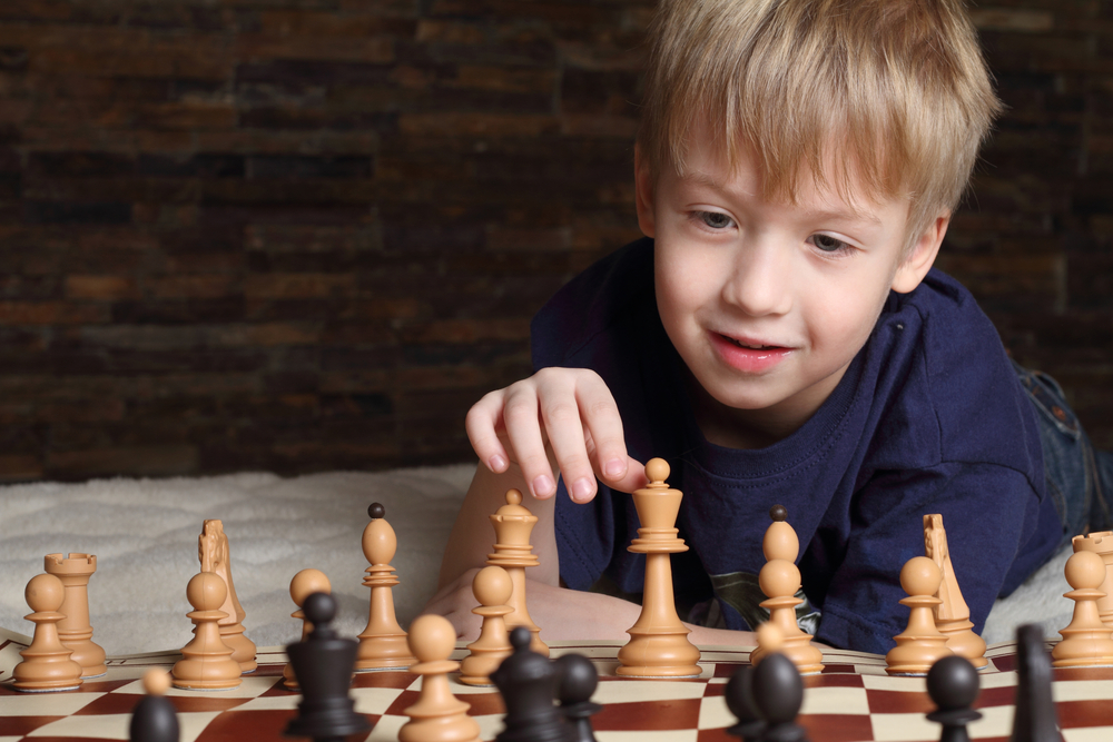 Child playing chess.