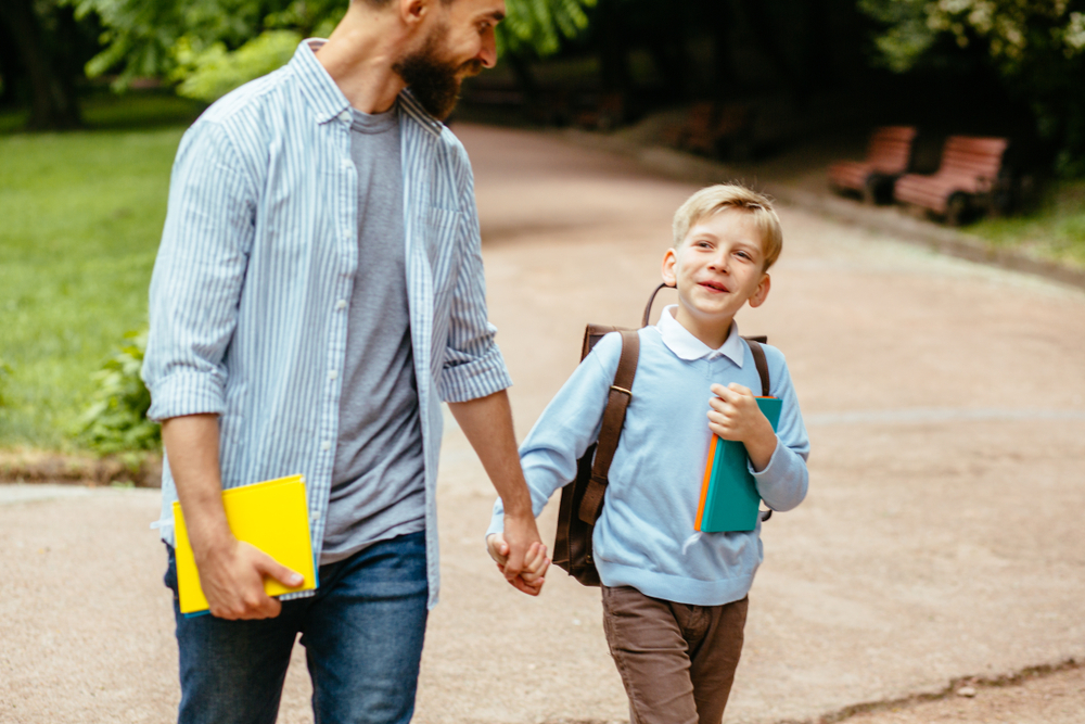 father and son going to school