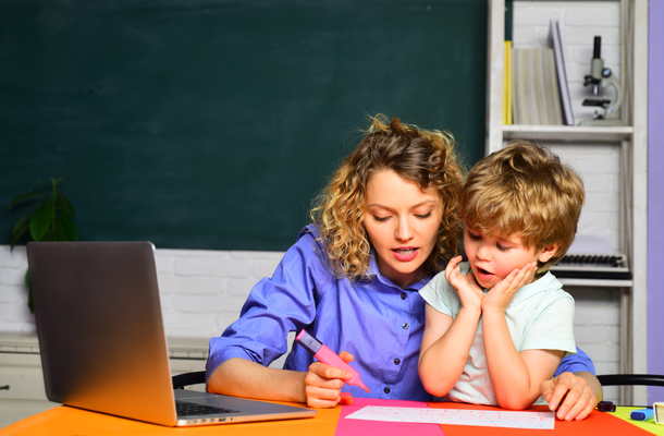 teacher and a kid doing math