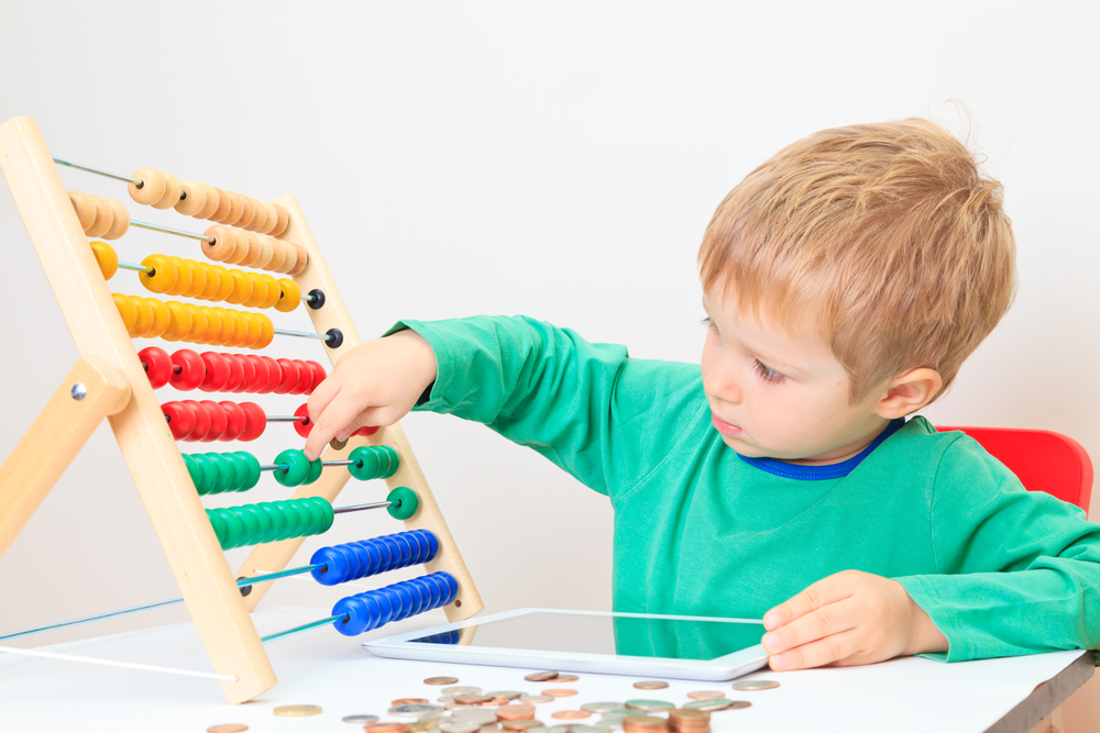 boy playing with abacus