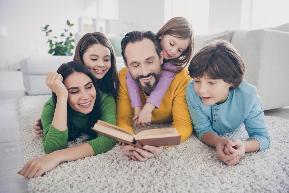 family reading a book