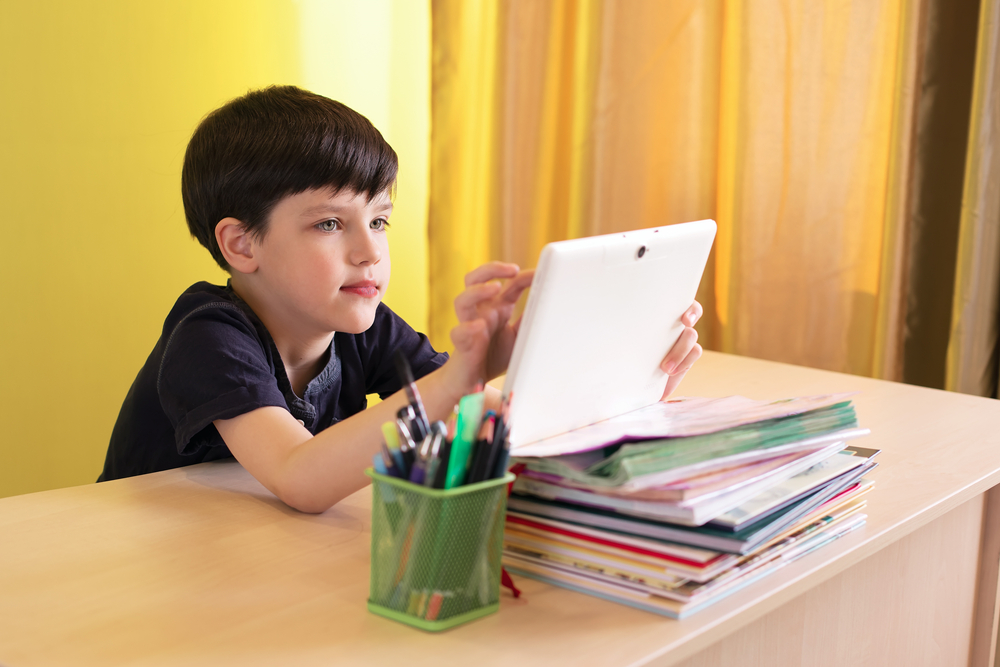 a boy with a tablet