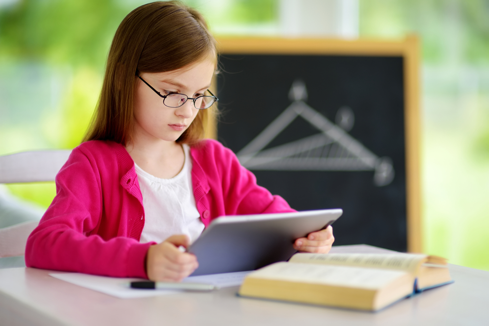 girl looking at ipad