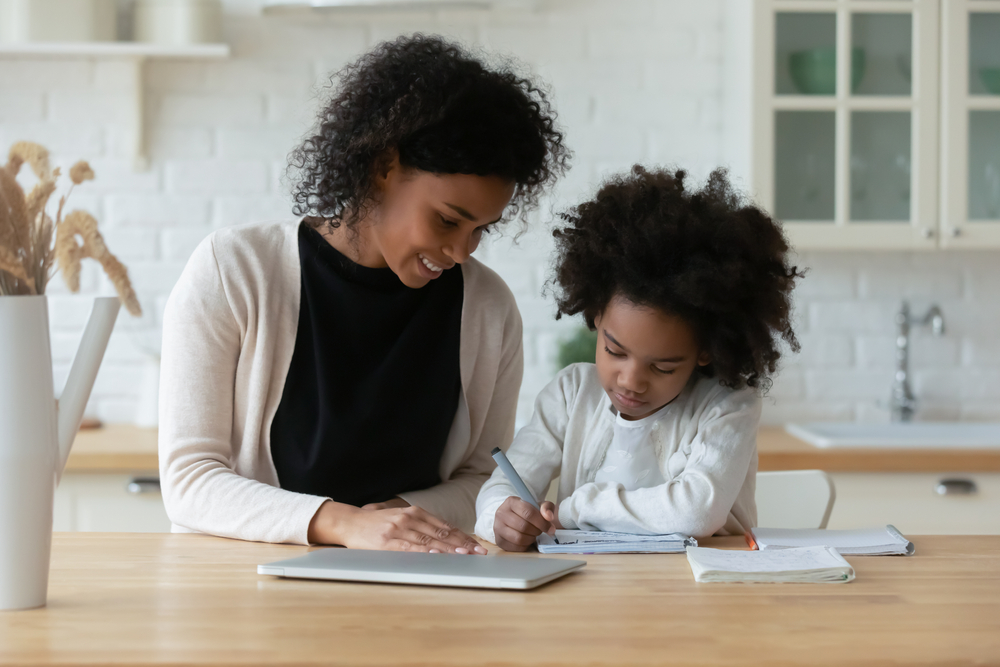 mom with daughter making homework