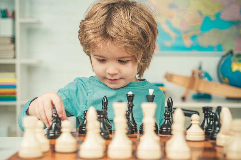 boy playing chess