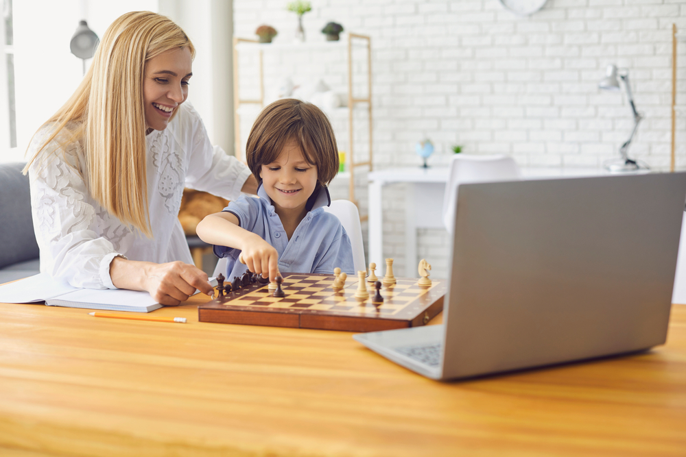 mom and son playing chess