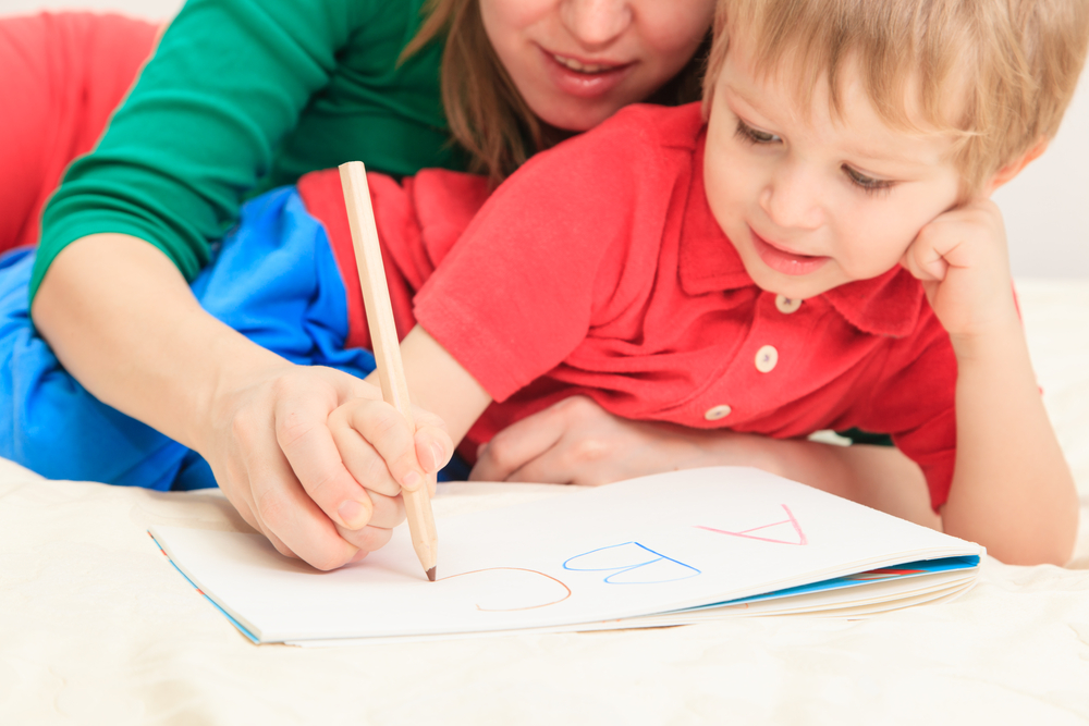 mom teches her son to write