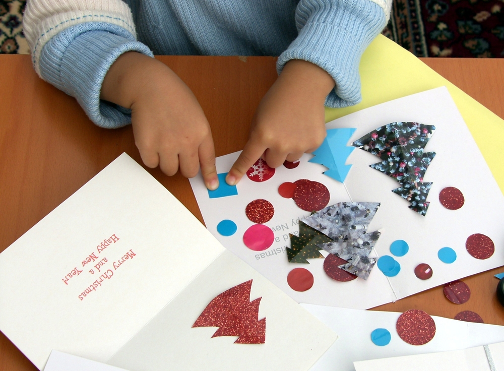 kid making gifts for new year