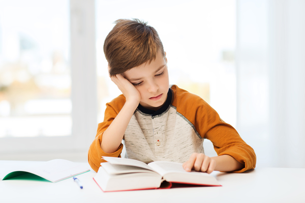 a boy reading a book