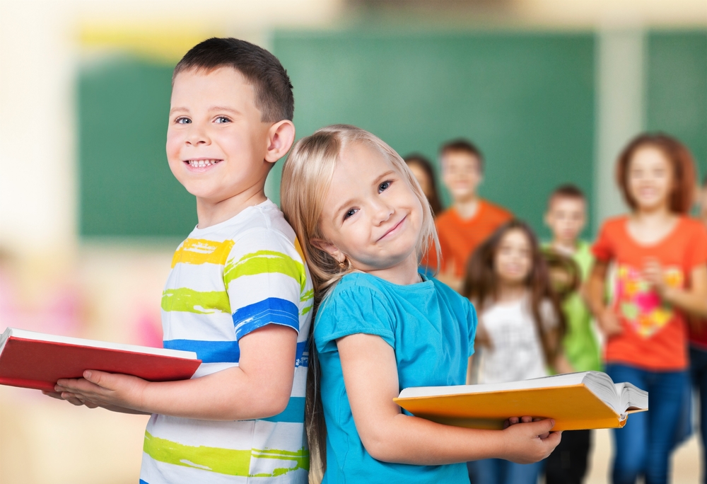 School children smiling.