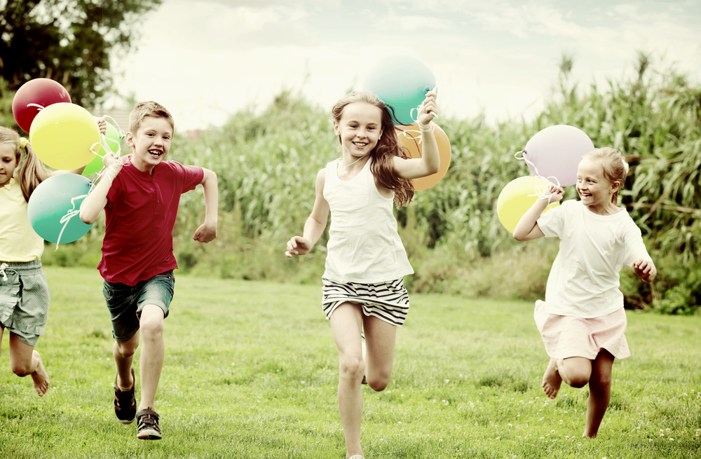 Children running, balloons.