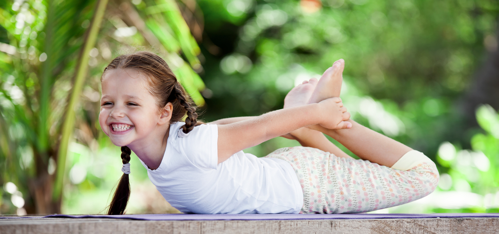 child doing yoga