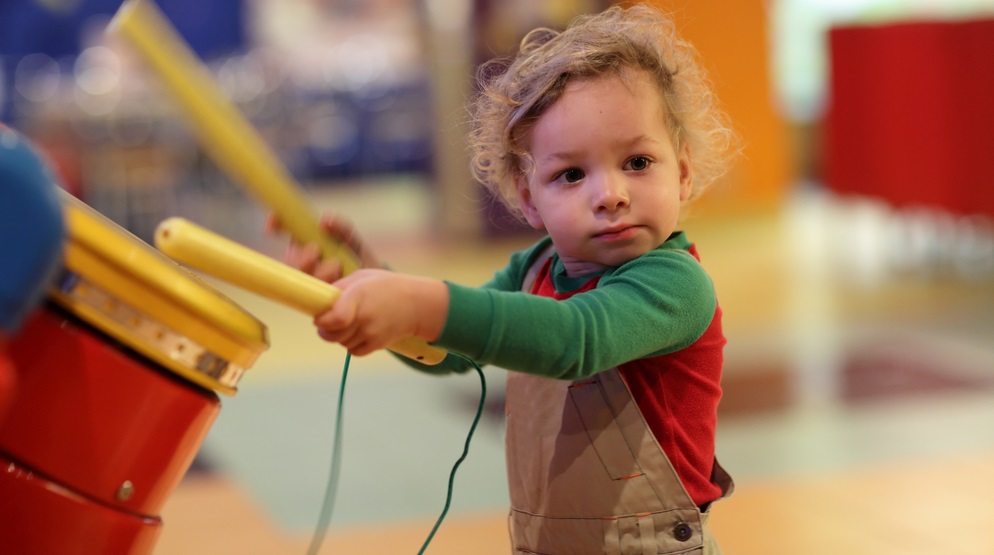  Child playing the drum