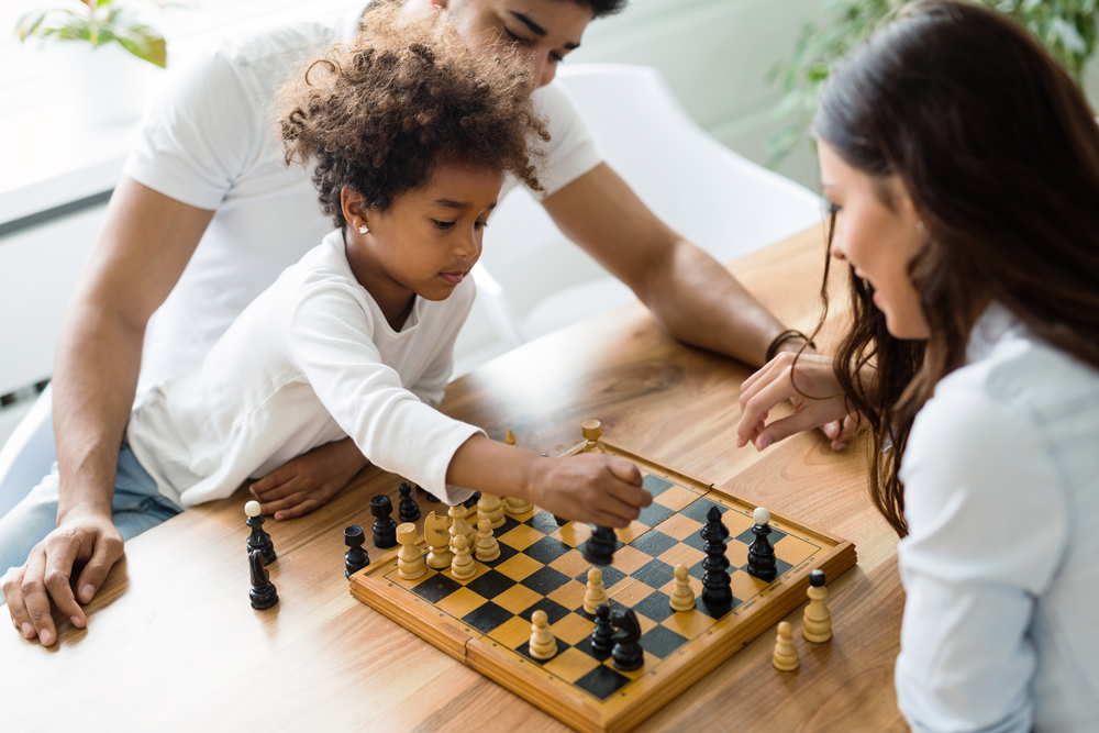 Family playing chess.