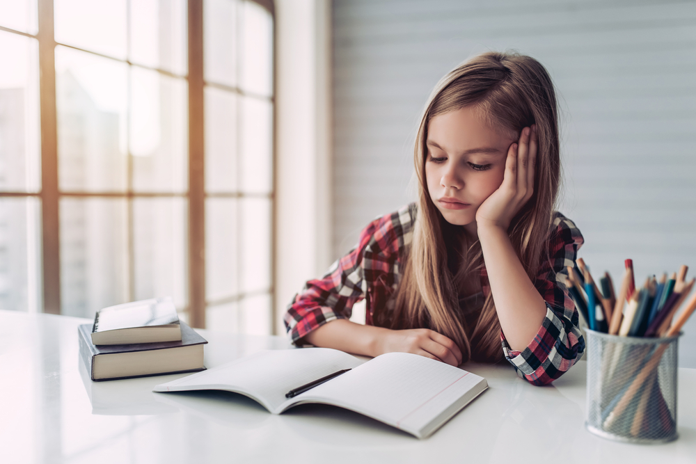 a girl is reading a book