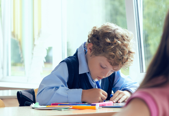 a boy is writing