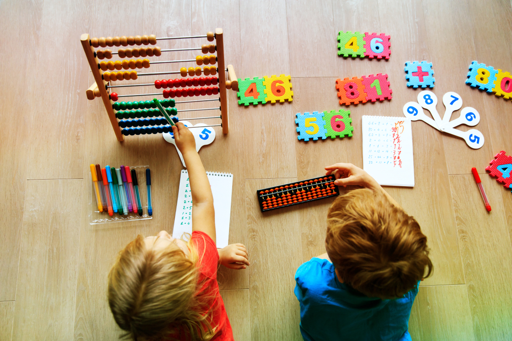 boy and girl solving math problems