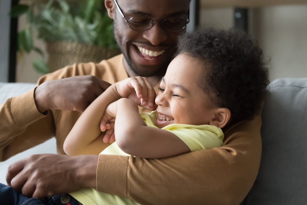 father playing with his child