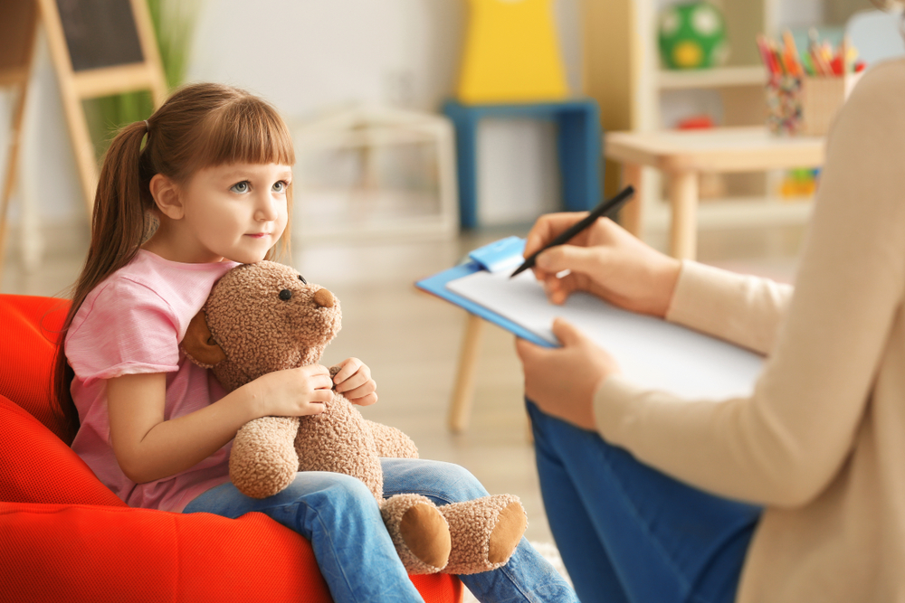 teacher talking to a girl