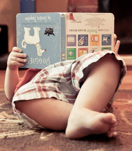 a kid reading a book